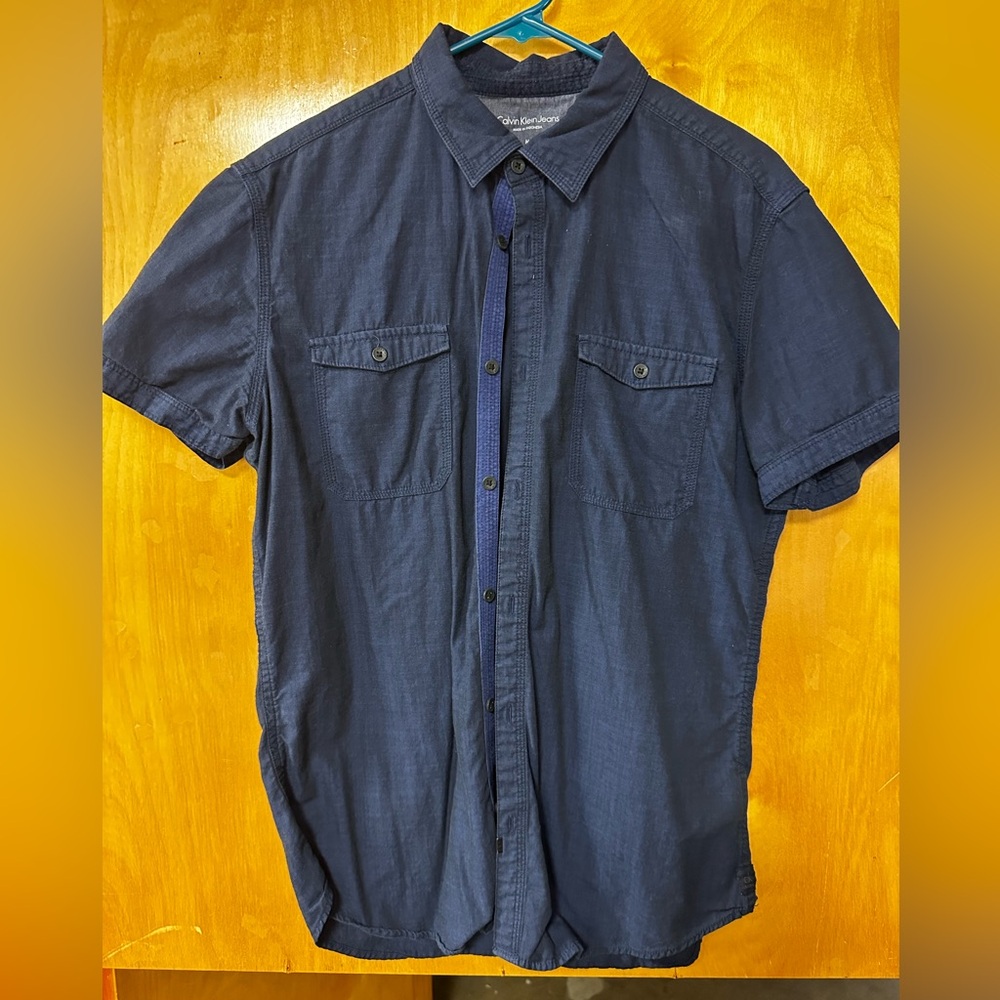 Calvin Klein jeans 
Navy blue short sleeve 
Size medium